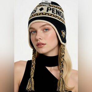 Penguins NWT Knit Cap Black and Yellow. Will fit older children and women.